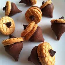 Here are six adorable thanksgiving day treats to have around turkey day. Honey Butter Chocolate Peanutbutter Acorns Cute Thanksgiving Desserts Thanksgiving Treats Acorn Cookies