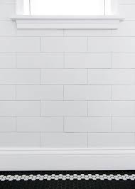 White subway tile with white grout shower. Happy Tile Day Yellow Brick Home