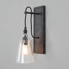 Speaking to industrial or farmhouse styles, this fixture presents sleek metal and gentle curves on smooth, geometric shapes. Historic Industrial Seeded Sconce In 2021 Rustic Wall Lighting Industrial Wall Sconce Rustic Wall Sconces
