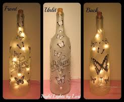 Wine+bottle+with+lights+inside | decorative wine bottle light embellished with blue glass gems, leaves. Believe Black And White Butterfly Wine Bottle Night Light Strand Of 20 Mini Lights Inside Hole Drilled I Wine Bottle Crafts Bottle Crafts Lighted Wine Bottles