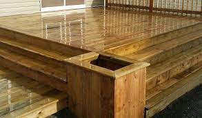 The beauty of treated lumber is that it is protected against the elements and insects, which cleaning treated lumber is easy due to this protection, which is provided by chemicals that are rubbed into or. Brown Pressure Treated Wood Flower Box Built In To Deck Www Dreamdeckandfence Ca Wood Flower Box Hamptons House Box Building