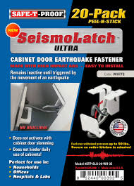 Outside, the structure's oblique exterior features vertical strips of metal cladding in matte charcoal grey. Seismolatch Ultra Automatic Cabinet Door Earthquake Latches Safe T Proof