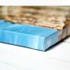 Paint it the color of your choice, and then use a hot glue gun to affix the painting on the pieces of wood so it looks like a stretched canvas. 1