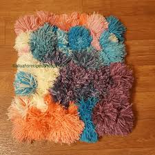 Covered in a rainbow of pom poms, it's a bright addition to a kids bedroom, bathroom, or any area of the house that needs a little extra cheer. Pom Pom Rug