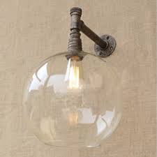 Crafted of formed steel, this indoor fixture features a cylinder shade with frosted inner glass and clear outer glass for a unique look. Rustic Single Light Indoor Wall Light With 11 81 Glass Shade In Antique Bronze Beautifulhalo Com