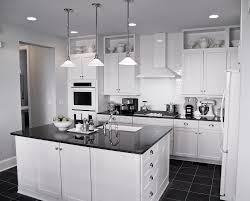 If you love a classic black and white combination, this modern version featuring a shiplap island, and square wood hood, will make you want a tuxedo kitchen of your own! The Tuxedo Kitchen Trend Explained Home Building And Remodeling Experts In Plymouth Minnesota Mn