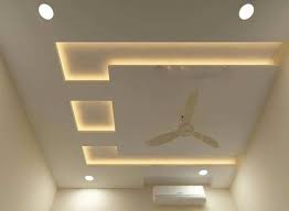 This false ceiling design has a wooden base, a fan placed in the centre, recessed lighting on the periphery, and two warm flush mounts on either sides. Pop Ceiling Design Photos Living Hall Cheaper Than Retail Price Buy Clothing Accessories And Lifestyle Products For Women Men