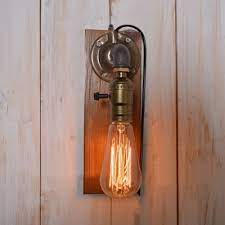 Each piece is handmade from rustic plumbing pipe with an upcycled valve accent. Industrial Pipe Wall Sconce With Wooden Lamp Base In Bronze Finish Beautifulhalo Com