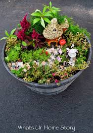 Rocks make the base for this fairy garden in an old wood bucket. How To Make A Fairy Garden Whats Ur Home Story