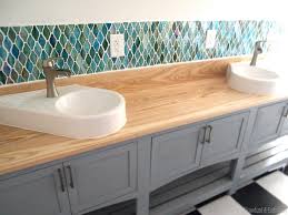 A glass tile backsplash in your kitchen or bathroom announces itself with shimmering light and rich colors. 15 Glass Backsplash Ideas To Spark Your Renovation Ideas
