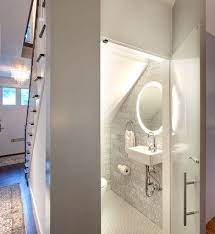 Simple Ways To Add A Half Bathroom And What To Consider Before You Start Bathroom Under Stairs Small Half Bathroom Modern White Bathroom