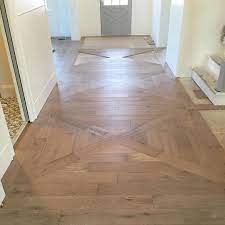 The Foyer Is A Great Way To Make An Entry And Glad We Changed Up This One To Incorporate A Simple X Pattern We Almost Flooring Wood Floor Pattern Wood Floors