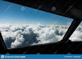 Pilots View Out of the Cockpit Window Toward Clouds and Blue Sky Above  Fotografering för Bildbyråer - Bild av fönster, bakgrund: 147637221