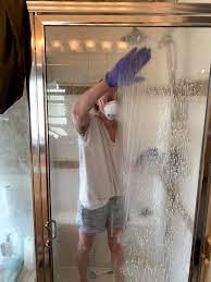 How To Remove Hard Water Stains From Glass Shower Doors The Forked Spoon Hard Water Stain Remover Deep Cleaning Tips Cleaning Hacks