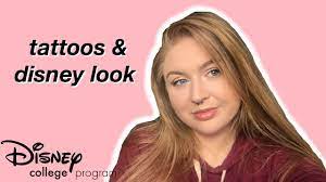 … so technically, yes you can have tattoos (and many cast members do) but they must be covered by clothing, a watch or make up while you are in costume* and on. Can I Have Tattoos And Work For Disney Body Modifications Disney Look Youtube
