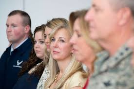 Rebecca Weaver Clarke, listens while her spouse, Lt.