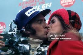 Closeup of Jackie Stewart victorious, kissing wife Helen after... News  Photo