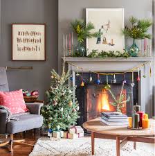 Make sure to use scented candles and place a jar filled with fairy lights and some pine cones around those candles. 32 Stylish And Cozy Christmas Living Room Decor Ideas