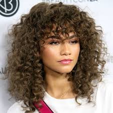 Separate your hair into 3 sections, then loosely braid it all the way to the ends and secure the braid with a hair tie. 63 Cute Hairstyles For Short Curly Hair Women 2020 Guide