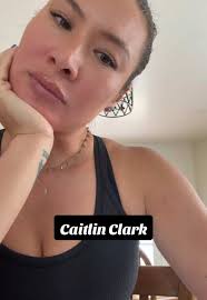 Katlyn Clark Red and and White Nikes