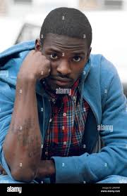 Anthony McCray Jr. displays a tattoo