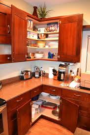 Induction cooktop, stainless steel appliances, cherry cabinets, shaker cabinets, under cabinet lights. Fabulous Hacks To Utilize The Space Of Corner Kitchen Cabinets Amazing Diy Interior Home Design