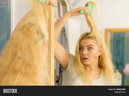 There will be times when you may need to work through tangles on dry hair, so here's how to do it without pulling handfuls of hair out in frustration. Blonde Woman Having Image Photo Free Trial Bigstock