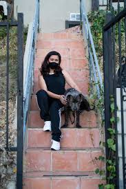 Front steps are meant to welcome guests, to invite friends and family in for a spell. Portrait Of Woman Sitting On Steps Outside Of House Wearing Athletic Casual Attire With Her Pet Dog Noun Project