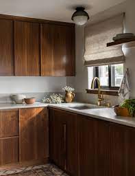 Dark Walnut Cabinets Give This Kitchen A Great Mid Century Feel We Love How It Is Paired Wi Kitchen Backsplash Designs Kitchen Interior Kitchen Cabinet Design