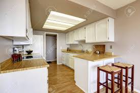 See more ideas about kitchen design, white kitchen, kitchen pictures. Small Kitchen With White Cabinets And Wooden Counter Top Stock Photo Picture And Royalty Free Image Image 59949837