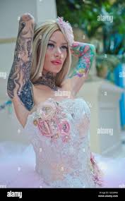 Becky Holt Showcasing Tattoos And Wedding Dress By Philippa Lusty At The Great British Tattoo Show In Alexandra Palace Stock Photo Alamy