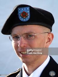 U.S. Army Private Bradley Manning is escorted as he leaves a military...  News Photo