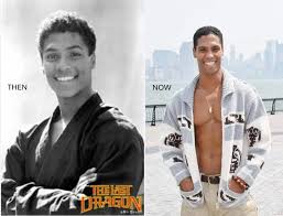 This is Bruce Leeroy. He is black and asian. His birth mother is Siamese  and his dad is black. He shares a birthday with Bruce Lee which is how he  got his