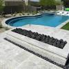 Ideal for indoor or outdoor applications, these natural stone pavers are durable and have various shades of tan that create a subtle visual interest. 1