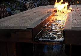 Create a spark with one of our fire pit conversation sets for the backyard or patio. Outdoor Dining Table Meets Fire And Water Pond Trade Magazine