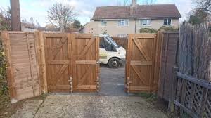 Automatic driveway folding gate, automatic composite sliding gate,folding. Bi Folding Gates In Welwyn Garden City Hertfordshire Jarrett Fencing