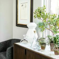 Organize the home bar with a bar cabinet for spirits, wine and drinkware. Marble Top Bar Cabinet Design Ideas