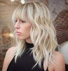To maximize this length, add some beach waves to widen the appearance of the hair and add a youthful softness. 40 Styles With Medium Blonde Hair For Major Inspiration