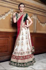 Traditional Off White Raw Silk Wedding Lengha With 3 Colour Velvet Borders And Emerald G Indian Bridal Outfits Asian Wedding Outfits White Indian Wedding Dress