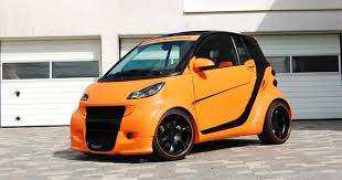 Big Orange Smart Im Breitbau Look Smart Ganz Wild Smart Fortwo Cabrio Auto Der Woche Smart Fortwo Smart Car Cute Small Cars