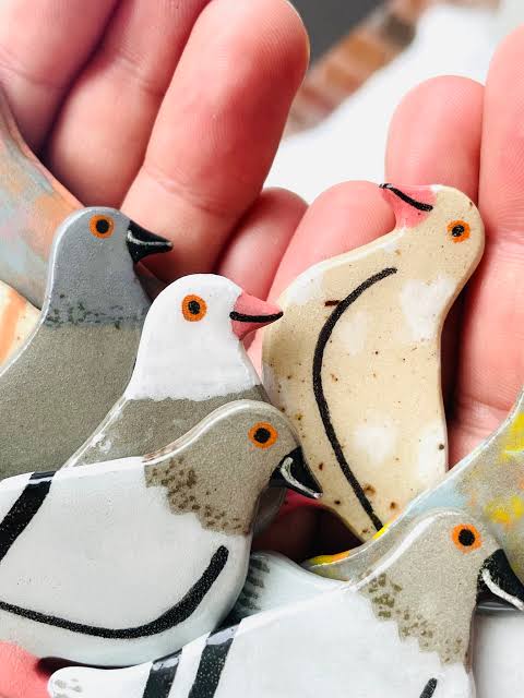 Hand-painted ceramic clay pigeons by artist