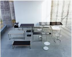 The table's legs are made of sleek brass metal legs and rustic storage shelf. Adjustable Table E 1027 Side Table Classicon Quick Ship Crystal Glass Clear Steel Tube Chromed Classicon 101adj01 00