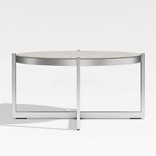Its transparent top surface allows the beauty of your flooring to show through and makes small rooms seem bigger. Dune Round Outdoor Patio Coffee Table With Pebbled Glass Reviews Crate And Barrel