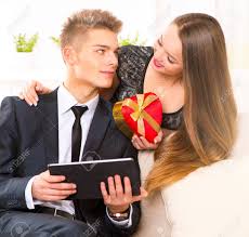 Valentine's day is just around the corner, but there's still plenty of time to find a thoughtful gift. Valentine S Day Happy Woman Giving A Gift To Her Boyfriend Stock Photo Picture And Royalty Free Image Image 35403212