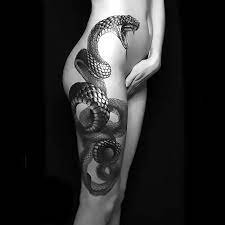 3d realistic snake tattoo on leg with real snake snake eyes tattoo on the hand by graynd scary snake on skulls tattoo Best Snake Leg Tattoo Idea