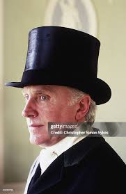 Mr Christopher Lawrence-Price dons his top hat prior to mounting his...  News Photo