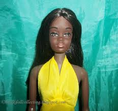 Yellow towel and sunglasses complete the beach ensemble, updated with an accompanying sunscreen bottle. Black Doll Collecting Her First Doll Was Malibu Barbie