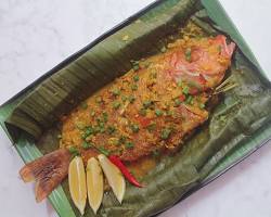 Gambar Pepes Ikan Mas at Warung Makan Mbak Yanti, wrapped in banana leaves and grilled to perfection.