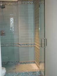 Combined with different sized square tiles and mixed in with the conch shell resin tiles, blue and white glass tiles and stainless steel tiles these fun mosaics would be great in a beach chic kitchen or a coastal bathroom retreat. Blue Glass Tile Shower Traditional Bathroom Other Houzz