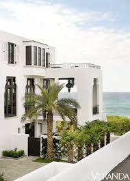 Black And White Spanish Style Home Exterior White Spanish Mediterranean Style With Black Windows Florida Beach House Beach House Interior Beach House Exterior
